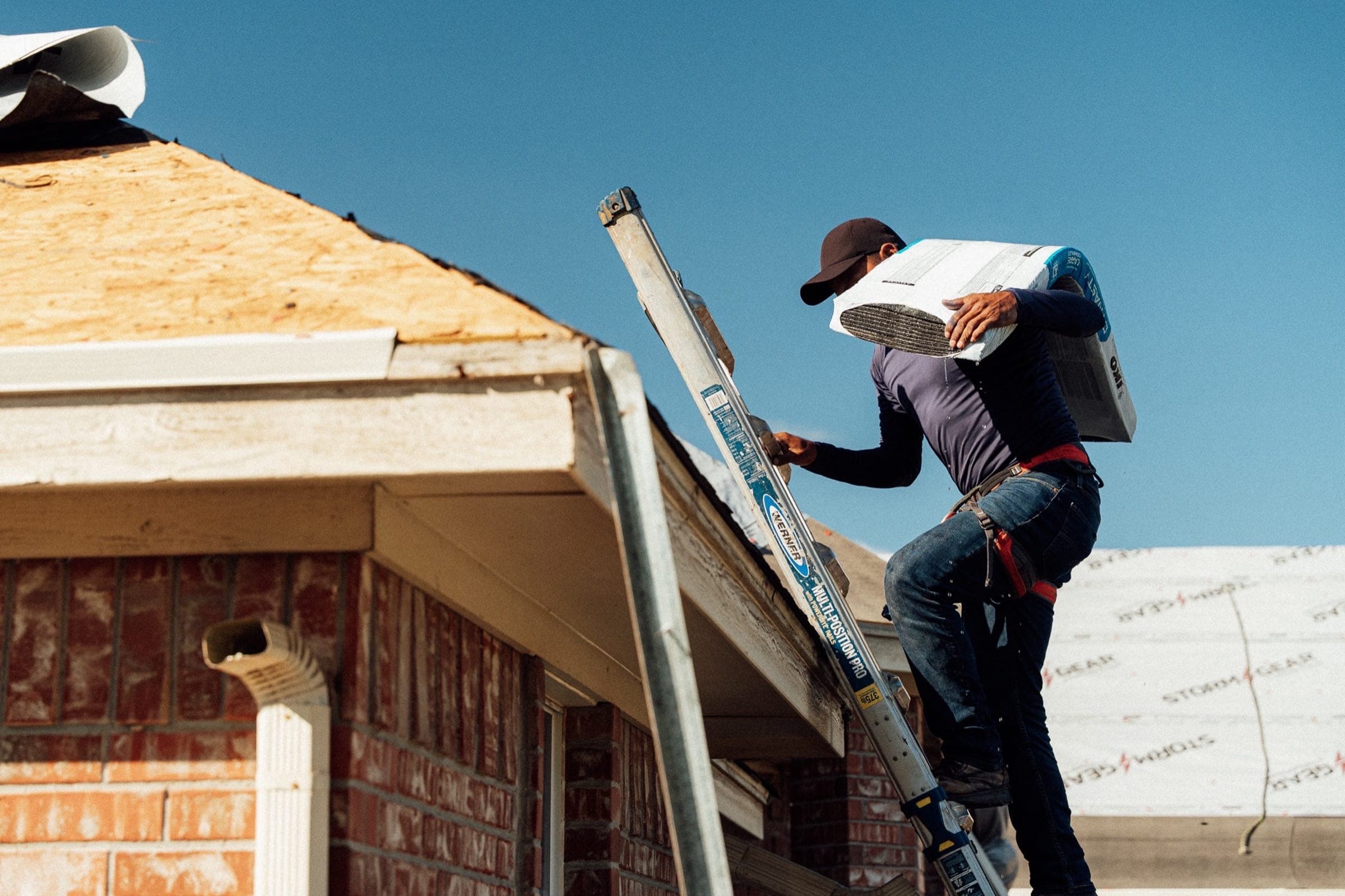 Construction worker on ladder