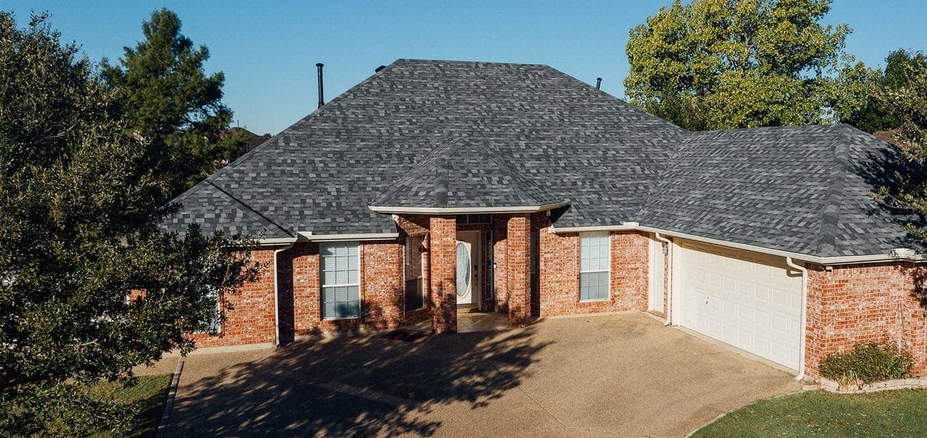 Completed shingle roof on a brick home