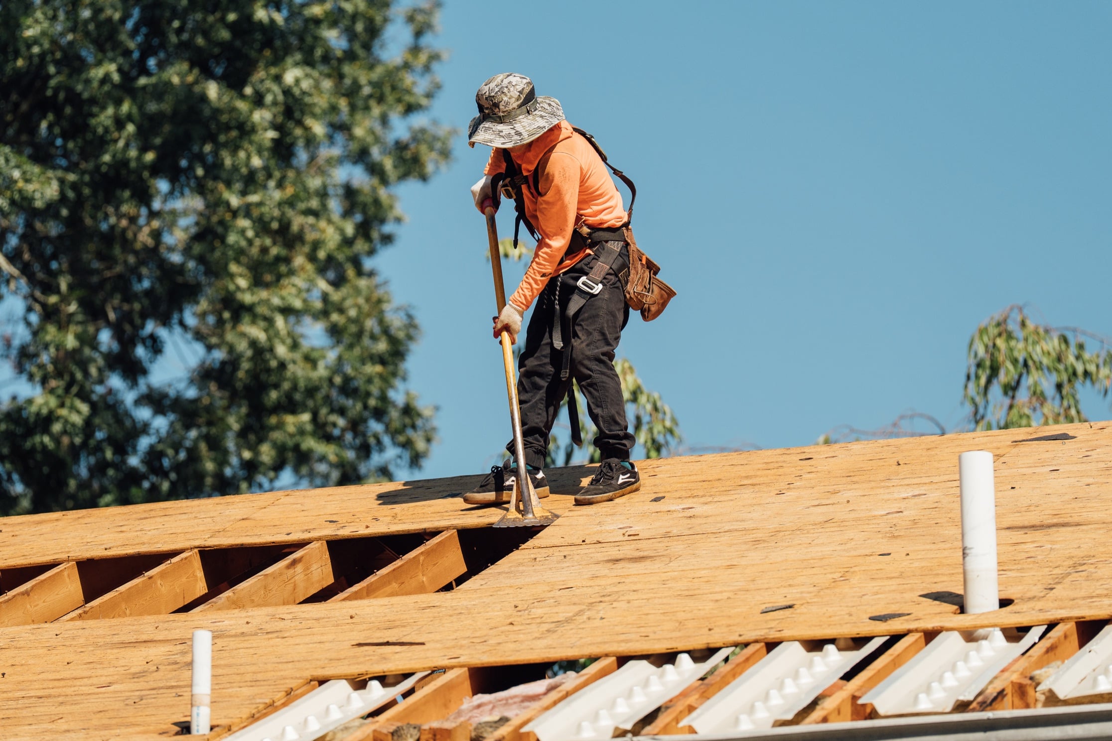 Remi roofing professional working on a roof